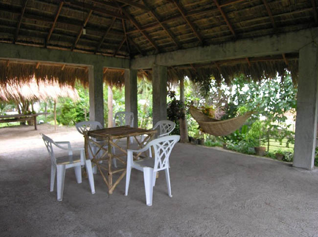 Beachfront Private Resort Near Lucena City Improvements include Caretaker Cottage, Rustic Pavilion, Beach shelters and BBQ, and a large Garage/warehouse with accommodation, all set on a well-maintained, fenced, and generally level property.