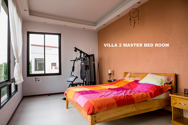 the master bedroom of the 2nd villa