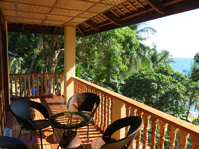 Beachfront: Two Bungalows and 1,713 SQM Land (Code: BF-7321) Beautiful outside view table chairs guardrail