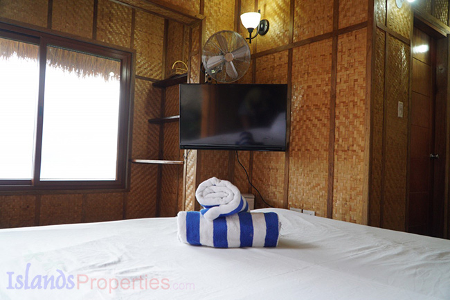 This is the bedroom with tv and aircon. Ocean View Beach Villa Property for Sale